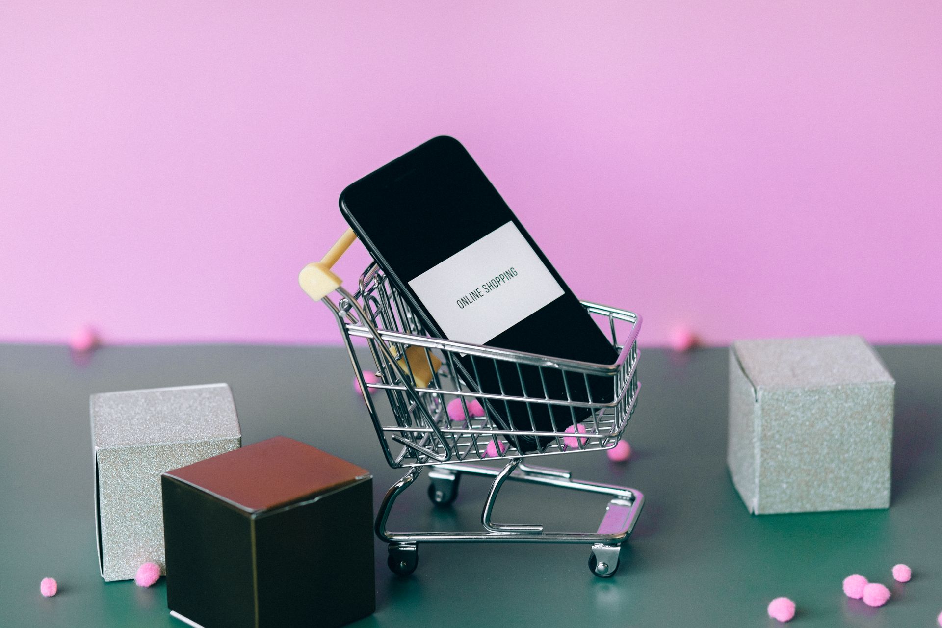 Shopping cart and smartphone representing an ecommerce checkout experience