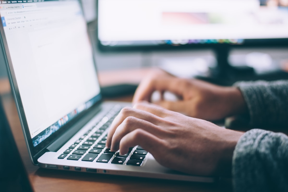 Shopify theme development designer at laptop