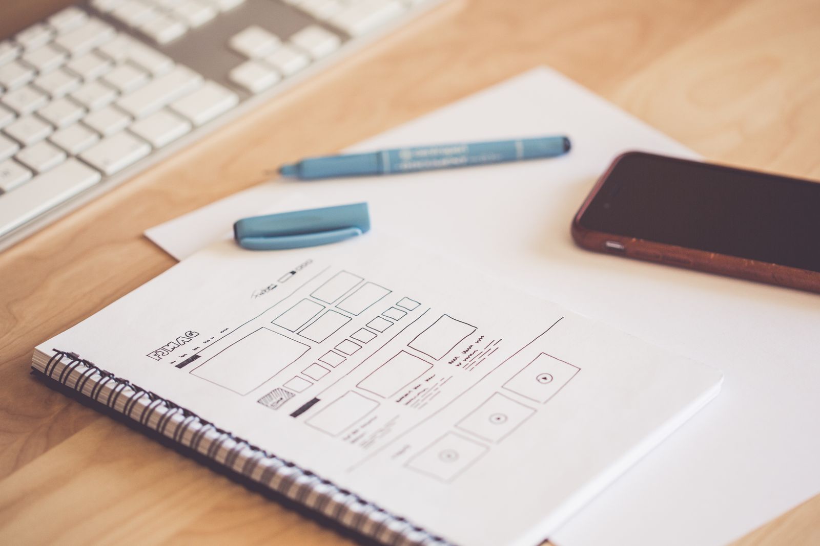 Wireframe sketches used to plan product and collection page layouts for a custom Shopify theme