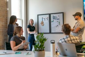 Ecommerce agency team reviewing a Shopify theme project plan together in an office